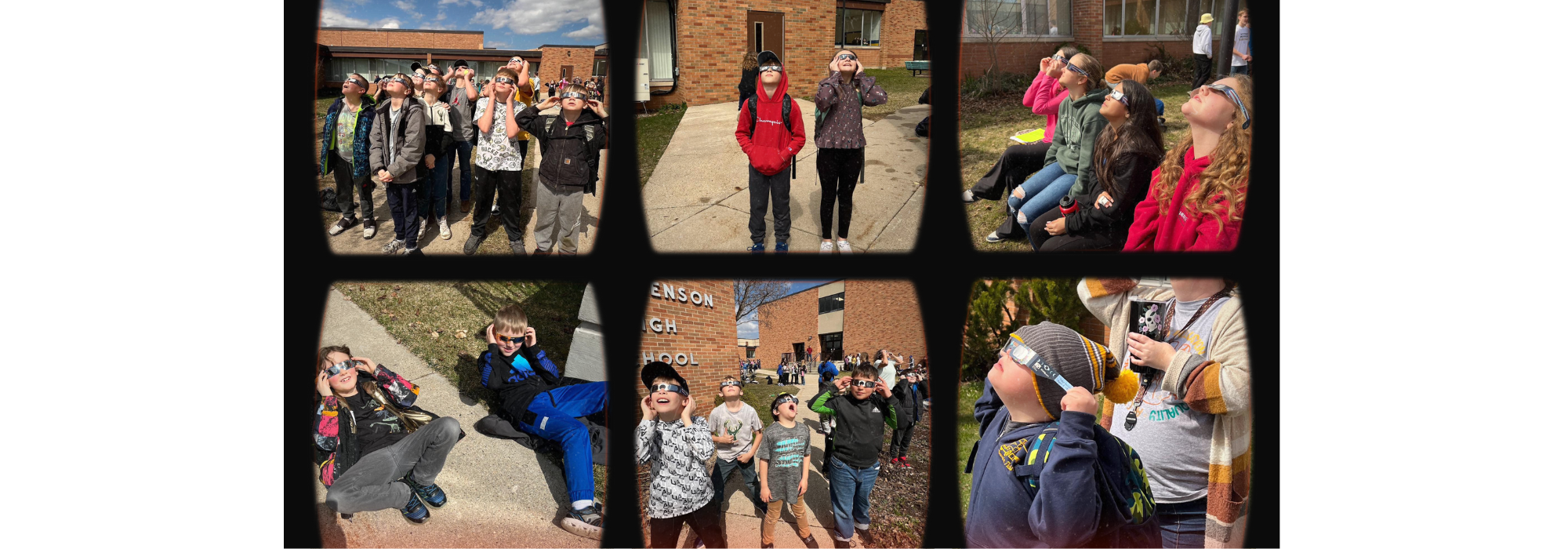 Students with glasses looking at eclipse